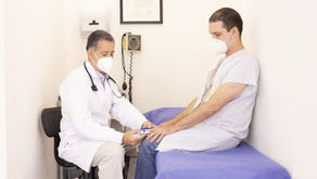 A doctor is checking on a patient