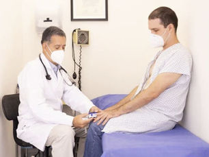 A doctor is checking on a patient