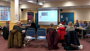 a group of people attending a meeting