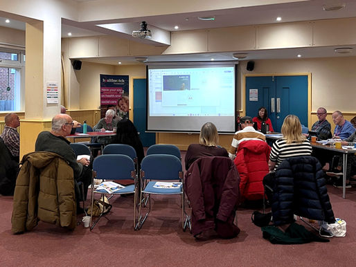 a group of people attending a meeting
