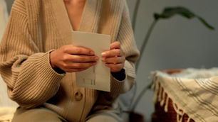 A women opening a letter