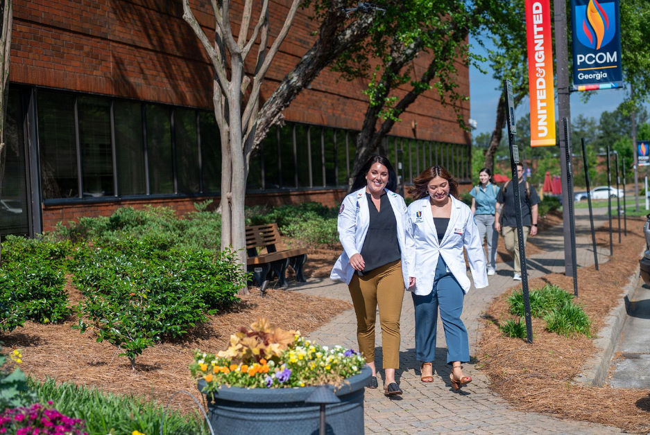 PCOM student doctors walking on campus