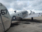 a silver metal United States Air Force plane with star emblem on the side