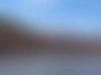 colorful buildings line the waterfront in Bosa