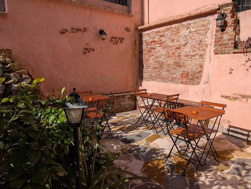 pink patio with tables and chairs