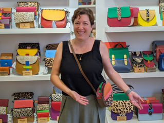 woman shows off a purse