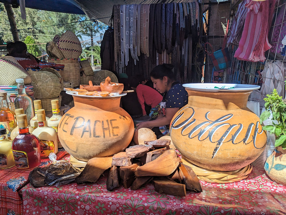 two clay vats labeled tepache and pulque