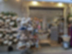 shop front with hats and straw bags