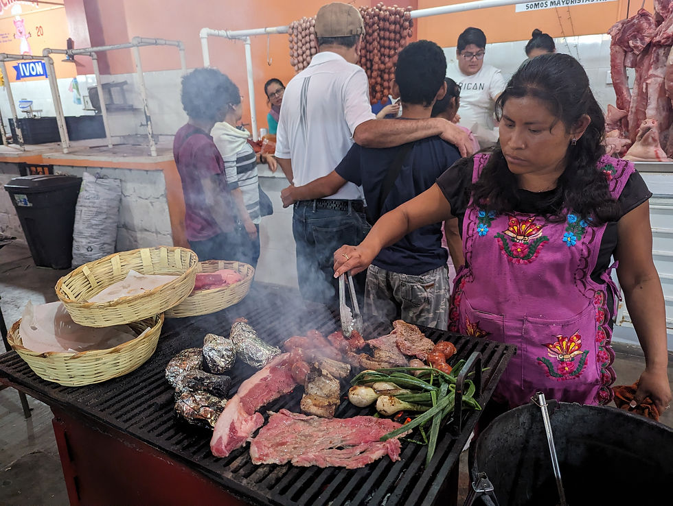 a woman cooks meat on a bbq