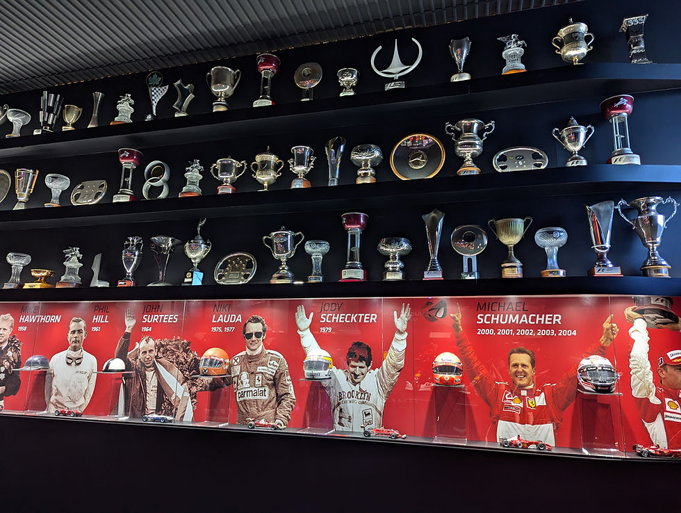 Ferrari trophies on a display wall