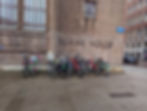 bikes lined up against a brick building