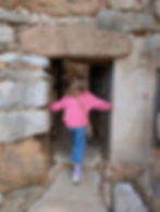 girl explores ancient site