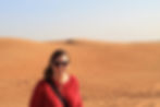 woman wearing red in the desert
