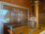 glass wall with winery name