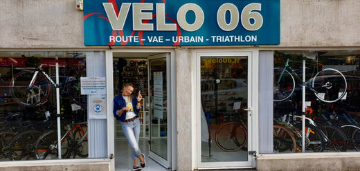 Aleksandra on the entrance to the Velo 06 bike shop