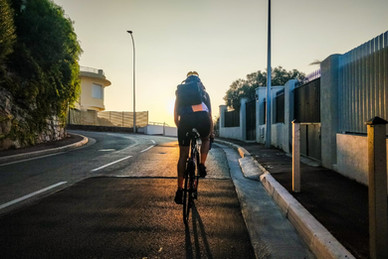 She's a cyclist climbing position Aleksandra