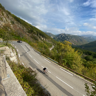 cyclist descending col de turini