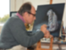 Artist Karl Hamilton-Cox painting snow leopard on leather Hereford UK known as leatherman