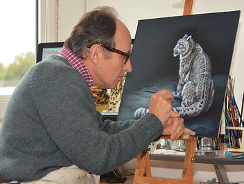 Artist Karl Hamilton-Cox painting snow leopard on leather Hereford UK known as leatherman