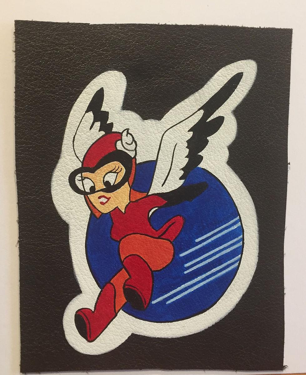 Thumbnail: Hand-painted leather patch with a cartoon woman inside a blue circle WASP