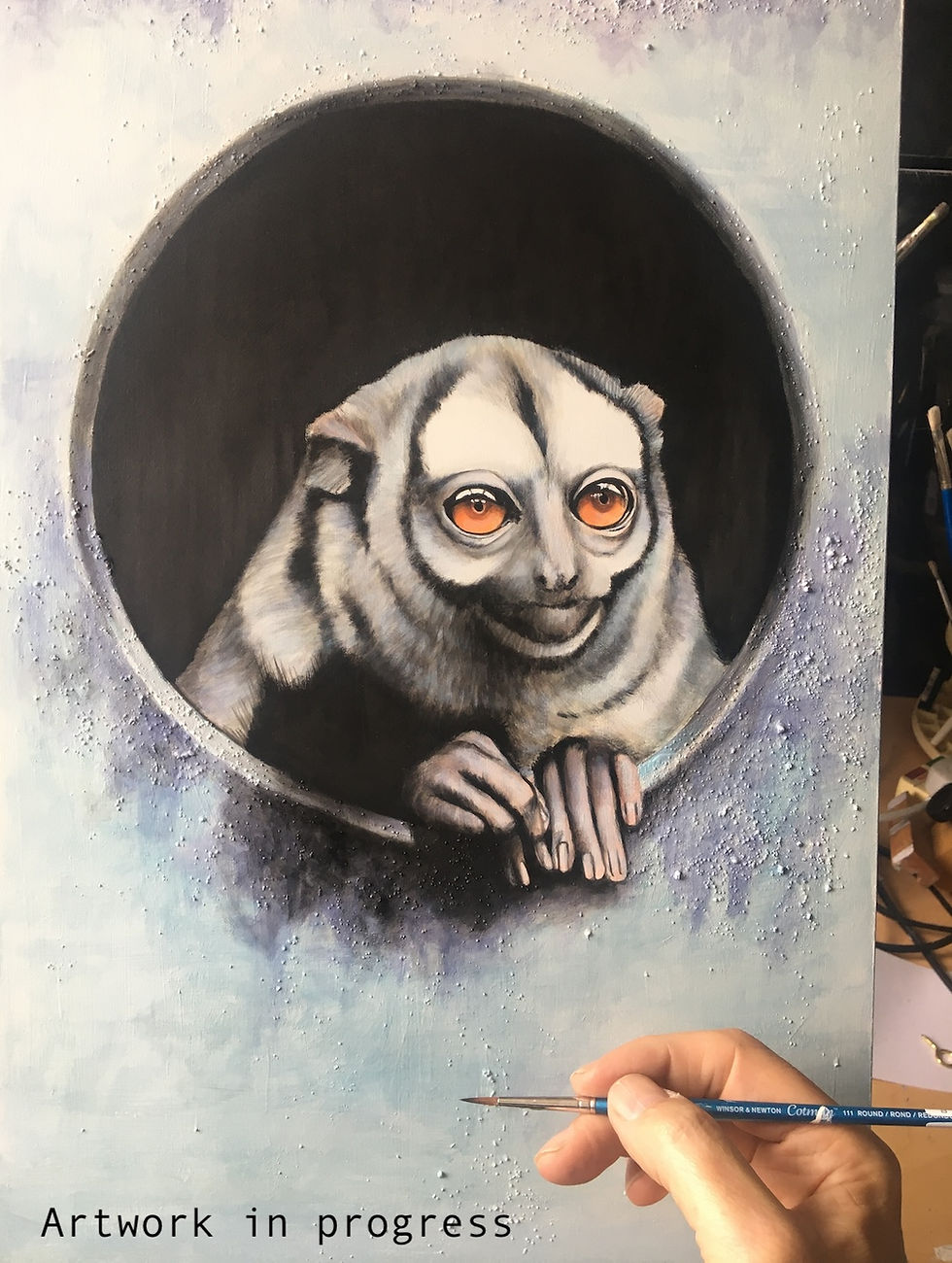 Thumbnail: Painting of a three striped night monkey, peering through a small porthole.