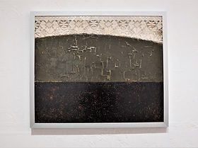 cement, tar, textile on wood