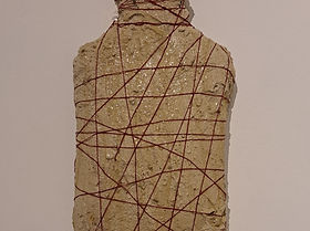Concrete, textiles, wires, varnish on a hot water bottle