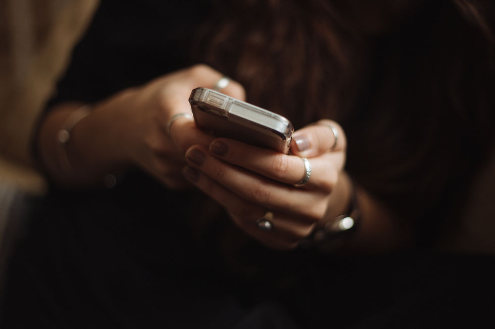 Close-up on woman's hands using smartphone