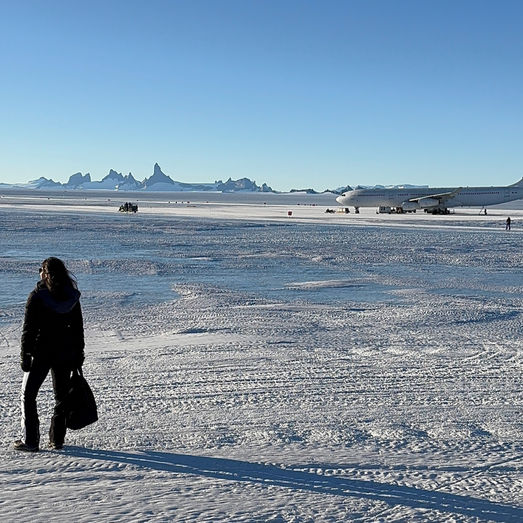 Janna, founder of AuthenticFood.com and food sociologist, standing in Antarctica during research on authenticity, food culture, and dining at the edge of the world.