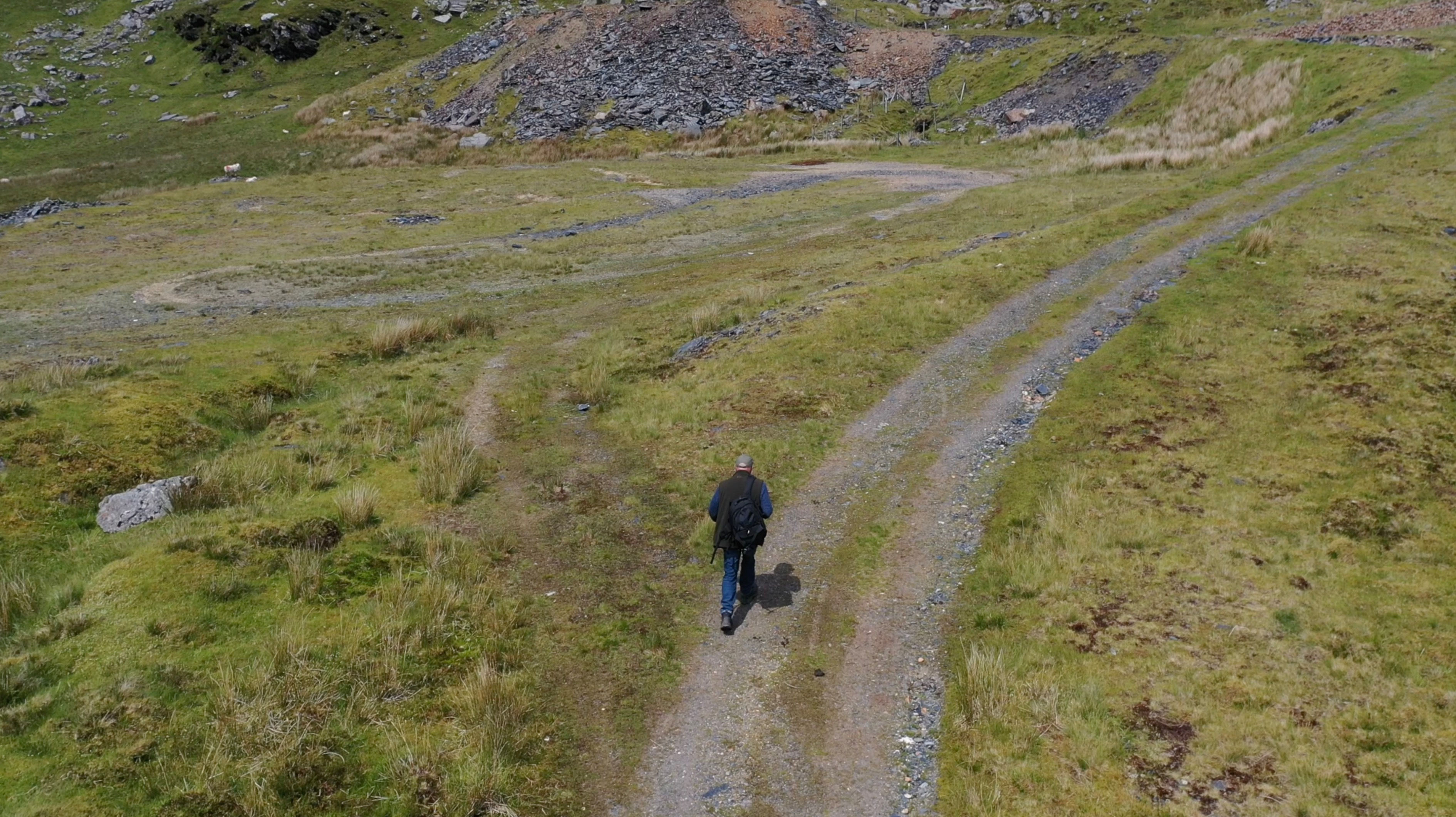 Aerial - Drone follows Male walker 2
