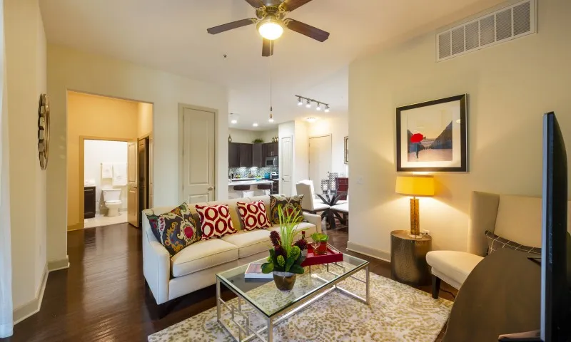 Spacious apartment living room with sofa and modern decor