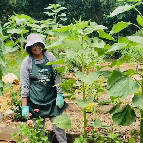 Adveline Minja in her garden