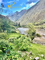 Clear view of mountains and blue sky from inside the Inca Rail The Voyager machu picchu in