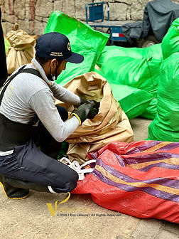 Man picking up trash in cuzco peru