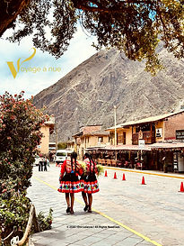 Woman walking in the streets of Ollantaytambo peru