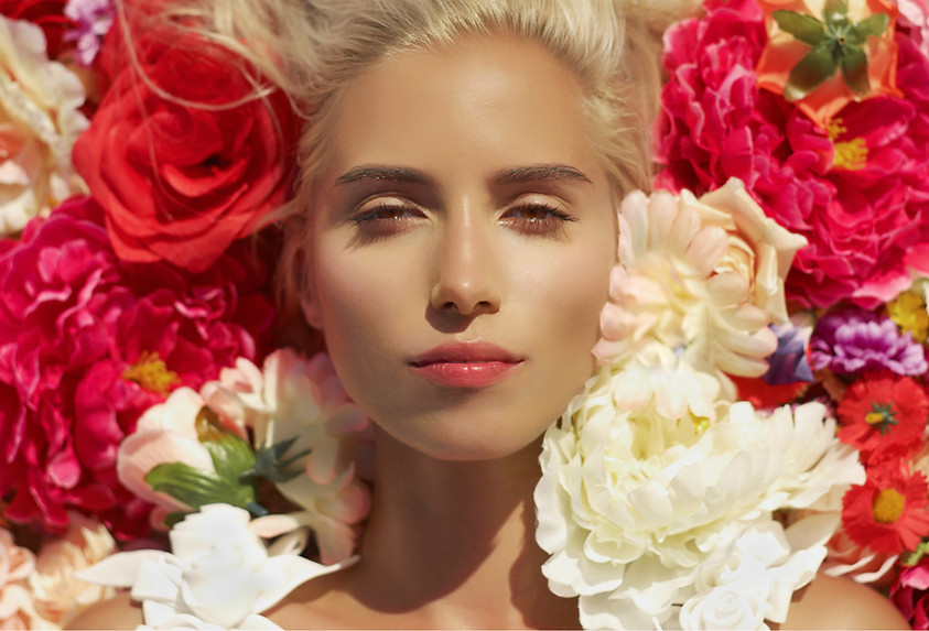 Woman Surrounded By Flowers