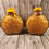 Thumbnail: two yellow shimmery potion bottles