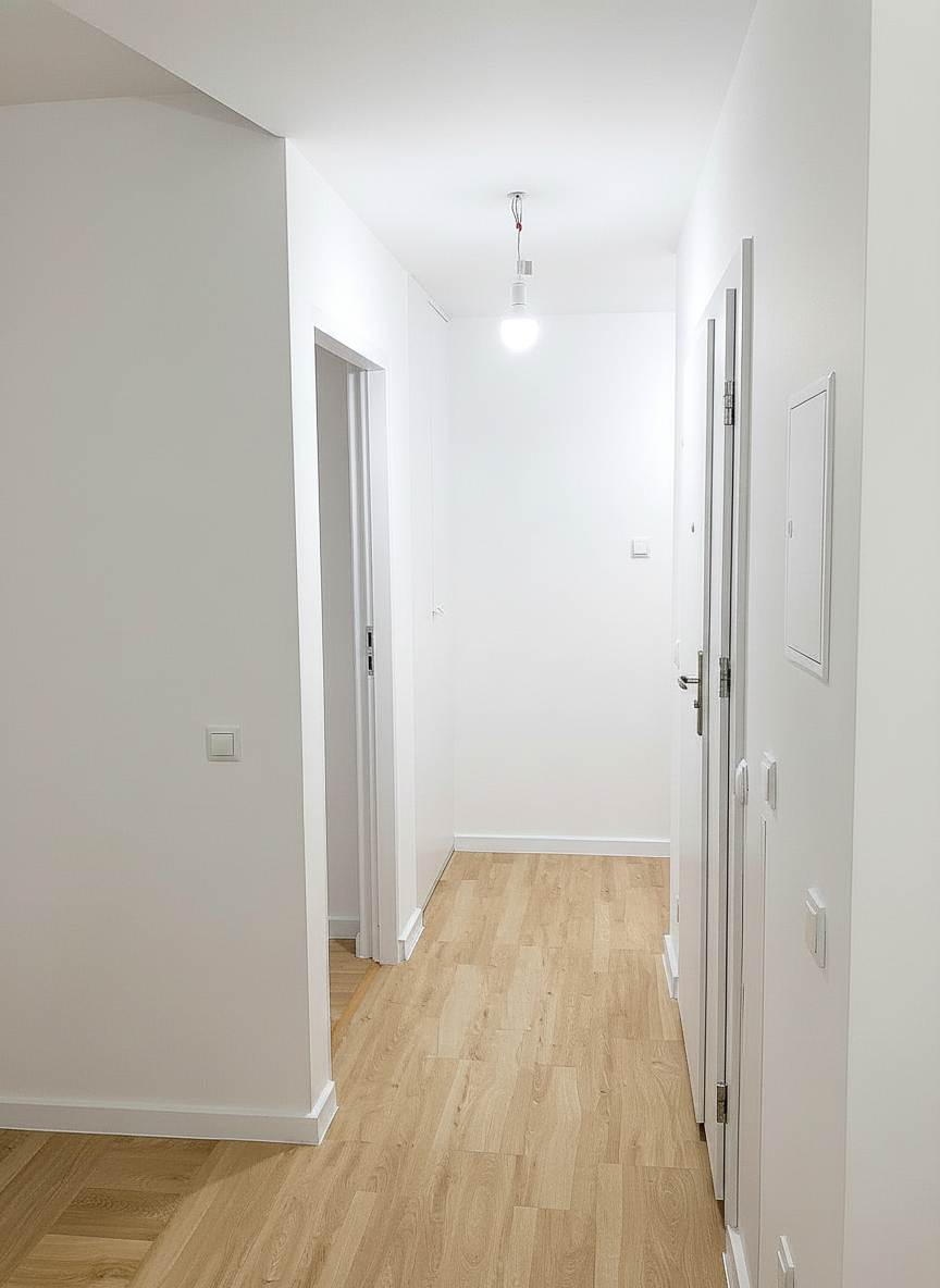 Modern white hallway with repair and installation services.