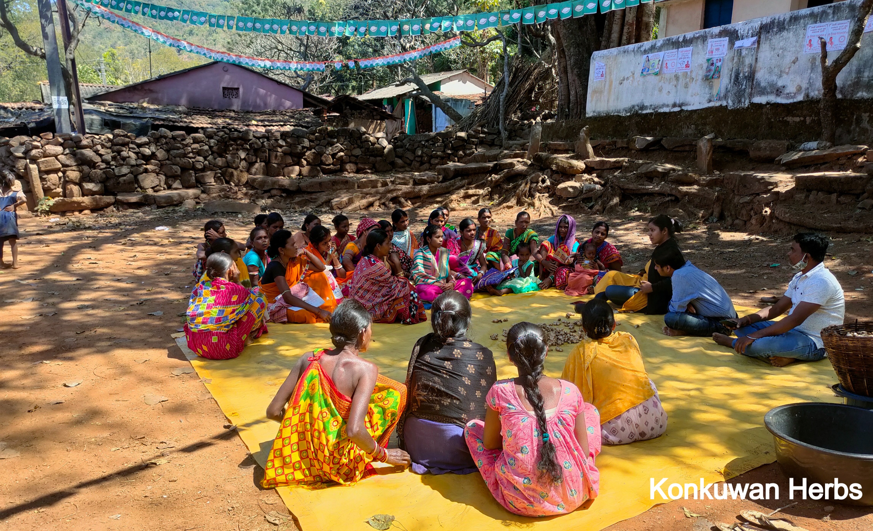 Roopali and farmers in a village meeting