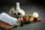 herbal-compress-herbal-spa-treatment-equipments-put-dark-floor_1150-34493.jpg