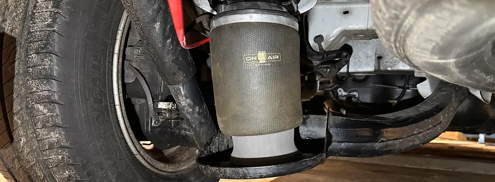 On Air branded air spring fitted in situ on vehicle chassis — On Air Suspension exclusive SABO air spring