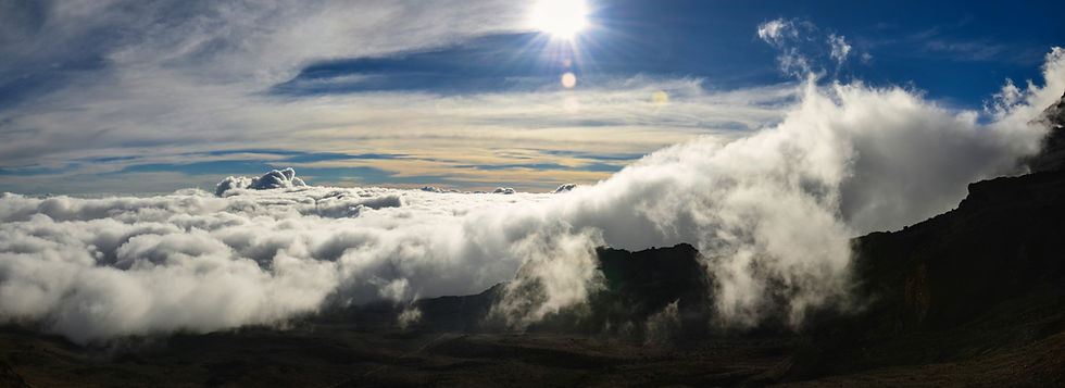 A background picture, featuring a mountain summit view, overlooking a sea of clouds beneath a blue sky and a shining sun.