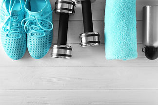 Fitness equipment on wooden background.jpg