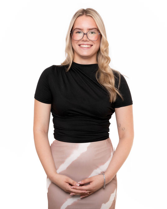 Professional headshot of a smiling woman against a white background, photographed by Harvey Aspell in Tunbridge Wells