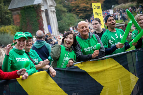 Supporters and runners representing Macmillan Cancer Support at the Royal Parks Half Marathon, London, October 2025, photographed by event photographer Harvey Aspell