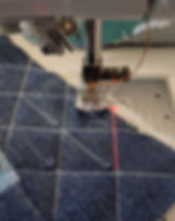 Laser guide aligned for accurate straight-line walking foot quilting.
