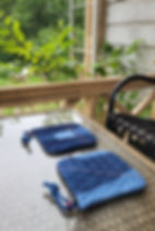 Reversible potholders made from quilted denim practice pieces.