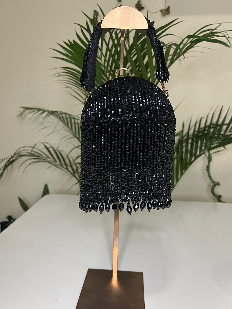 Black beaded dome shoulder bag with tiered fringe and crystal drops