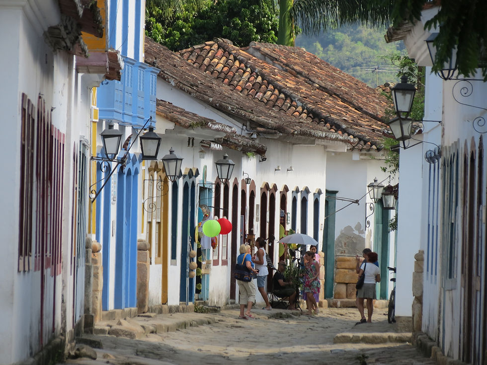 old houses line a street in Paraty, Brazil
