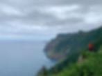 Hiker photographing the Madeira coastline